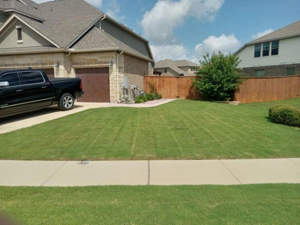 Eco Lawn Pros lawn care crew working on a Round Rock property