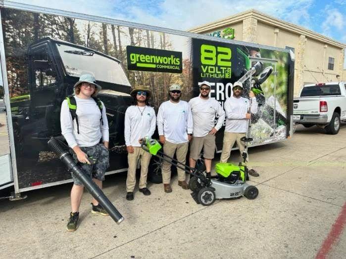 The Eco Lawn Pros team with their battery-powered equipment trailer